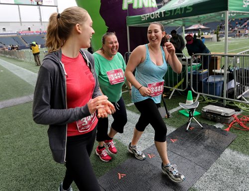 TREVOR HAGAN / WINNIPEG FREE PRESS
The 39th Manitoba Marathon, Sunday, June 18, 2017. Caroline Pasieczka (centre), Anastasia Pasieczka (right), along with an unidentified fellow 10K runner, have the look of relief as they cross the finish line in Investors Group Field