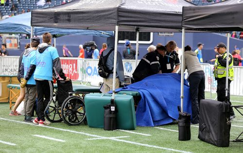 TREVOR HAGAN / WINNIPEG FREE PRESS
Half Marathon, mens winner, Daniel Heschuk, receives medical attention following the 39th Manitoba Marathon, Sunday, June 18, 2017.