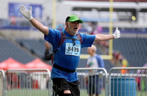 TREVOR HAGAN / WINNIPEG FREE PRESS
The 39th Manitoba Marathon, Sunday, June 18, 2017. Half marathoner Denis St. Hilaire shows his joy in returning to Investors Group Field.