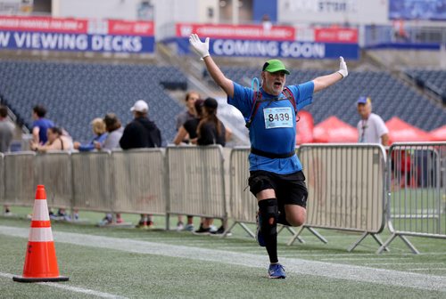 TREVOR HAGAN / WINNIPEG FREE PRESS
The 39th Manitoba Marathon, Sunday, June 18, 2017. Half marathoner Denis St. Hilaire shows his joy in returning to Investors Group Field.