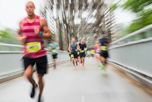 DAVID LIPNOWSKI / WINNIPEG FREE PRESS

Half Marathon participants run over the Elm Park Bridge Sunday June 18, 2017.