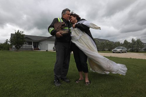 RUTH BONNEVILLE / WINNIPEG FREE PRESS

Feature, ELIE - Tornado anniversary
Les and his wife Lynn Kauppila of Elie Manitoba survived  a F5 tornado ten years ago that ripped their house from its foundation as they hid in the basement.    Emotions still rise up in them as they stand in front of their new home built on the same lot as the old one holding a couple items, (her wedding dress and his cowboy boots) , that were found in a farmers field across the road days later.    Story on how the couple and the community of Elie are doing on the 10 year anniversary of the biggest tornado to hit Canada. 

 See Kevin Rollason's story. 
June 15, 2017