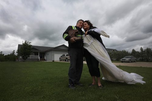 RUTH BONNEVILLE / WINNIPEG FREE PRESS

Feature, ELIE - Tornado anniversary
Les and his wife Lynn Kauppila of Elie Manitoba survived  a F5 tornado ten years ago that ripped their house from its foundation as they hid in the basement.    Emotions still rise up in them as they stand in front of their new home built on the same lot as the old one holding a couple items, (her wedding dress and his cowboy boots) , that were found in a farmers field across the road days later.    Story on how the couple and the community of Elie are doing on the 10 year anniversary of the biggest tornado to hit Canada. 

 See Kevin Rollason's story. 
June 15, 2017
