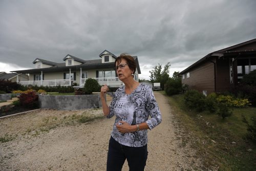 RUTH BONNEVILLE / WINNIPEG FREE PRESS

Feature, ELIE - Tornado anniversary
Jocelyne Godin describes to a reporter what it was like to loose her home after it was ripped from its foundation by a F5 tornado that touched down in Elie in June of 2007.  She survived by hiding in a bathroom in her sisters home across the field from hers.  Her home as well as homes to the left,  (now rebuilt), were completely destroyed.
 See Kevin Rollason's story. 

June 15, 2017