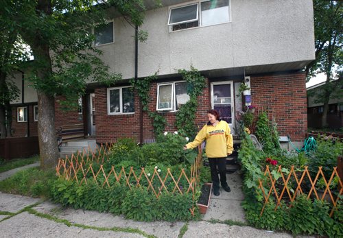 WAYNE GLOWACKI / WINNIPEG FREE PRESS

Olga Zhbanova with her garden of vegetables, herbs and flowers in the front yard of her Manitoba Housing unit at 1380 Raleigh St.  She lives across the lane for Korrina Hargreaves. They face the prospect of having their herbs and vegetables ripped out because of a agency policy that prohibits planting anything but grass in front yards.  Gord Sinclair story  June 19   2017