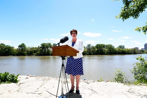 JUSTIN SAMANSKI-LANGILLE / WINNIPEG FREE PRESS
Eileen Clarke, Minister of Indigenous and Municipal Relations speaks at a press conference and ribbon cutting ceremony on the shore of the Red River Monday. The ceremony officially opened a new section of multi-use trials connecting Point Douglas to The Forks.
170619 - Monday, June 19, 2017.