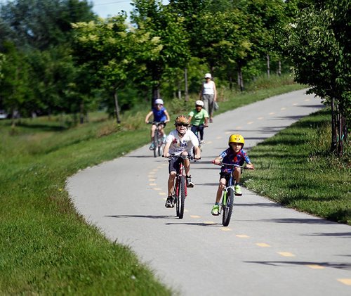 PHIL HOSSACK / WINNIPEG FREE PRESS  -   Young cyclists take advantage of the bikeway paralleling Chief Pequis trail between Gateway and Henderson Hwy Monday. See Kelly Taylor story.  -  June 19, 2017