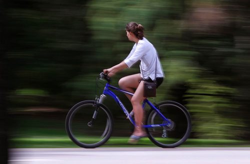 PHIL HOSSACK / WINNIPEG FREE PRESS  -   A cyclist spins along a riverside trail through Kildonan Park Monday. See Kelly Taylor story.  -  June 19, 2017
