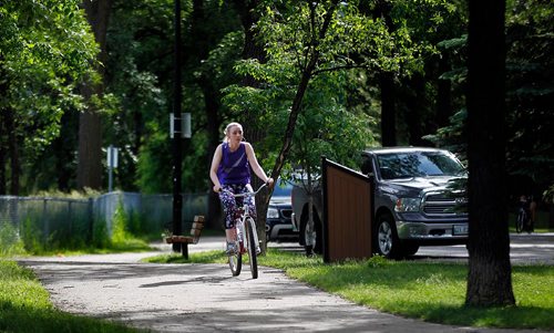 PHIL HOSSACK / WINNIPEG FREE PRESS  -   A cyclist spins along a riverside trail through Kildonan Park Monday. See Kelly Taylor story.  -  June 19, 2017