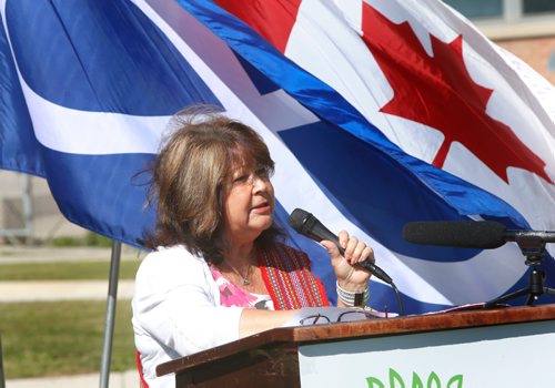 WAYNE GLOWACKI / WINNIPEG FREE PRESS

Billie Schibler, CEO for Manitoba's Metis Child & Family Services speaks at the Metis Red Heart Ceremony Tuesday to recognize Metis Residential and Day School Survivors. About 100 attended the ceremony beside the MMF building placing paper hearts in the ground with messages to honour and recognize residential and day school survivors.¤The event also included planting an apple tree in front of MMF building that will one day provide fruit for members of the community.  June 20   2017