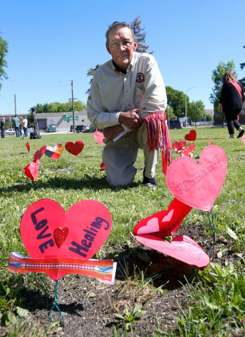 WAYNE GLOWACKI / WINNIPEG FREE PRESS

George Lavallee spoke about his painful residential school experiences at the Metis Red Heart Ceremony Tuesday to recognize Metis Residential and Day School Survivors. About 100 attended the ceremony held beside the MMF building placing paper hearts in the ground with messages to honour and recognize residential and day school survivors.¤The event also included planting an apple tree in front of MMF building that will one day provide fruit for members of the community.  June 20   2017