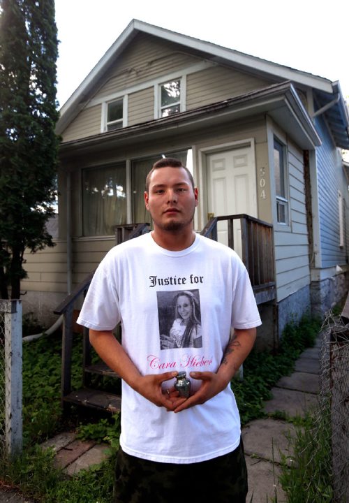 WAYNE GLOWACKI / WINNIPEG FREE PRESS

Sunday Cold Case. Jordan Belyk wearing a T-shirt with a photograph of his mother Cara Lynn Hiebert and holding a small urn with some of her ashes in front a house in the 500 block of Redwood Ave. where she was murdered in 2011.  Dave Baxter story  June 20   2017
