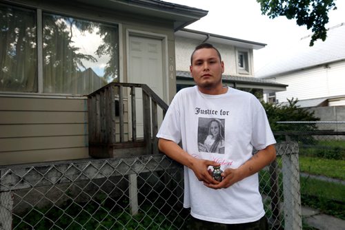WAYNE GLOWACKI / WINNIPEG FREE PRESS

Sunday Cold Case. Jordan Belyk wearing a T-shirt with a photograph of his mother Cara Lynn Hiebert and holding a small urn with some of her ashes in front a house in the 500 block of Redwood Ave. where she was murdered in 2011.  Dave Baxter story  June 20   2017
