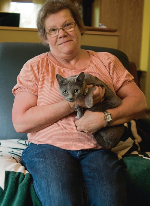 Canstar Community News June 13, 2017 - Joy Leschasin poses with her cat Memere-Pata Phaedra in her Whyte Ridge home. Leschasin is the show manager of the International Cat Show, hosted by the Manitoba Cat Club, on July 1 and 2. (DANIELLE DA SILVA/SOUWESTER/CANSTAR)