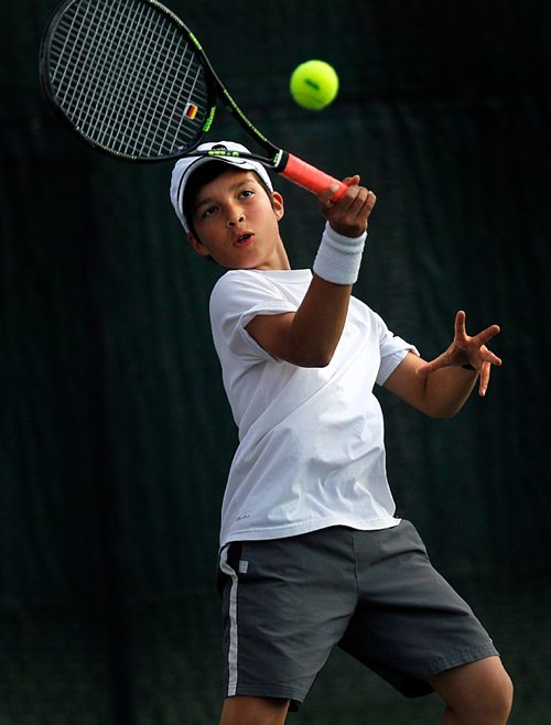 PHIL HOSSACK / WINNIPEG FREE PRESS  -   STANDUP/Agate - No quarter no mercy, 14 yr old Marcello Audino kept his eye on the ball and his mind on the match Tuesday night at the Manitoba Clay Court Championships. He too his match in two clean sets 6-0 and 6-0.   -  June 20, 2017