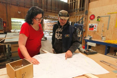 BORIS MINKEVICH / WINNIPEG FREE PRESS
Rainbow Stage stage project. Little Shop Of Horrors. In this photo, from left, set designer Lisa Hanchareks looks over blueprints of the set with head carpenter Louis Gagné. May 30, 2017

