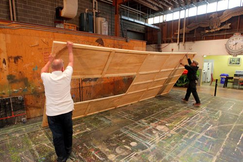 BORIS MINKEVICH / WINNIPEG FREE PRESS
Rainbow Stage stage project. Little Shop Of Horrors. In this photos some set builders move some of the unfinished panels into a staging area before final install. May 16, 2017
