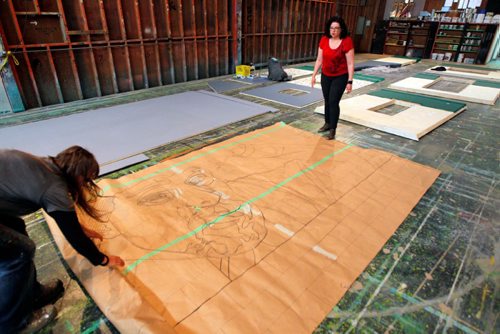 BORIS MINKEVICH / WINNIPEG FREE PRESS
Rainbow Stage stage project. Little Shop Of Horrors. In this photo set designer Lisa Hanchareks, right, in the shop as they prepare to paint a large mural. May 30, 2017
