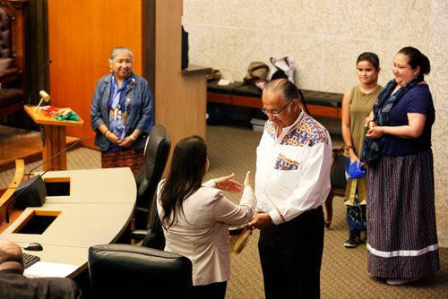 JUSTIN SAMANSKI-LANGILLE / WINNIPEG FREE PRESS
Obijway Elder Clarence Nepinak offers ceremonial smoke to Speaker Devi Sharma during the opening prayer Wednesday. This is the first time an indigenous person has performed the opening prayer in Council chambers and the first time a  non-council member has performed the prayer in the history of Winnipeg.
170621 - Wednesday, June 21, 2017.
