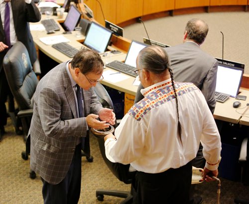 JUSTIN SAMANSKI-LANGILLE / WINNIPEG FREE PRESS
Obijway Elder Clarence Nepinak offers ceremonial smoke to Marty Morantz (Charleswood-Tuxedo-Whyte Ridge) during the opening prayer Wednesday. This is the first time an indigenous person has performed the opening prayer in Council chambers and the first time a  non-council member has performed the prayer in the history of Winnipeg.
170621 - Wednesday, June 21, 2017.