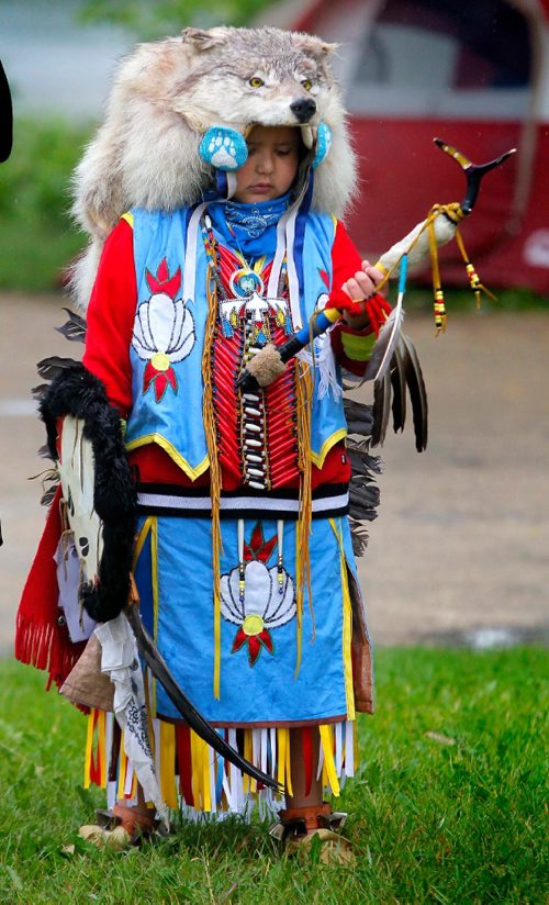 BORIS MINKEVICH / WINNIPEG FREE PRESS
APTN Aboriginal Day live at The Forks. Harley Bird,6, waits out the rain that delayed the event's grand entry. He is a dancer. June 21, 2017
