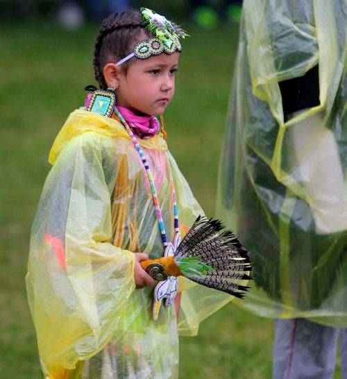 BORIS MINKEVICH / WINNIPEG FREE PRESS
APTN Aboriginal Day live at The Forks. Kiera Pagee, 6, of Winnipeg waits out the rain that delayed the event's grand entry. She is a dancer. June 21, 2017
