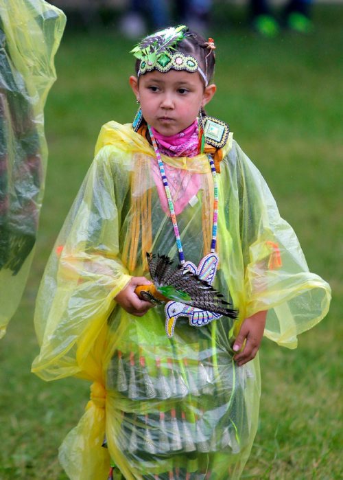 BORIS MINKEVICH / WINNIPEG FREE PRESS
APTN Aboriginal Day live at The Forks. Kiera Pagee, 6, of Winnipeg waits out the rain that delayed the event's grand entry. She is a dancer. June 21, 2017
