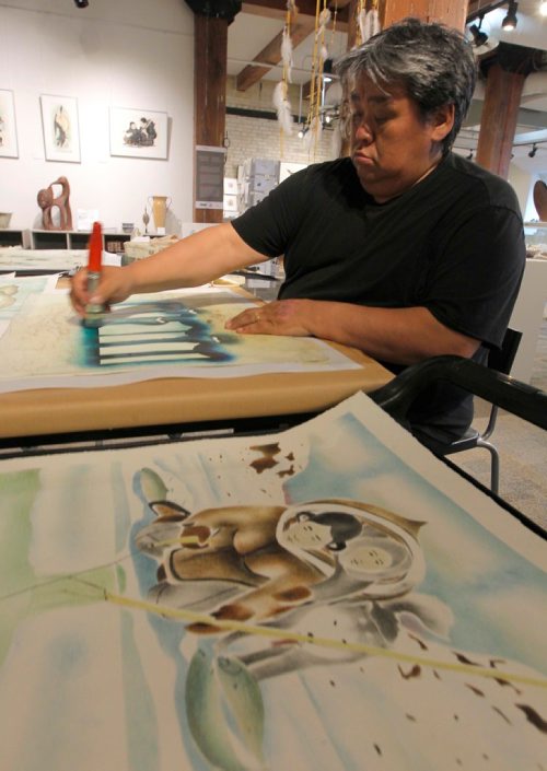BORIS MINKEVICH / WINNIPEG FREE PRESS
APTN Aboriginal Day live at The Forks. WAG Artists-in-Residence Andrew Qappik (Pangnirtung, NU) does a demo of his work at Johnson Terminal in the WAG store. June 21, 2017

