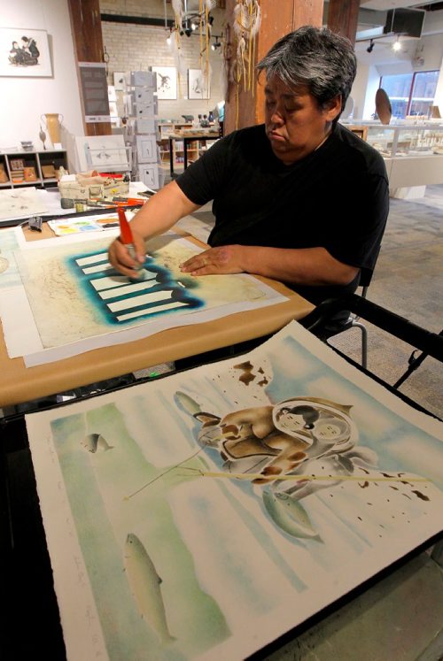 BORIS MINKEVICH / WINNIPEG FREE PRESS
APTN Aboriginal Day live at The Forks. WAG Artists-in-Residence Andrew Qappik (Pangnirtung, NU) does a demo of his work at Johnson Terminal in the WAG store. June 21, 2017
