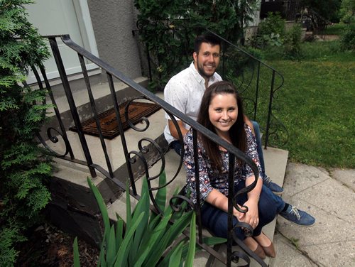 PHIL HOSSACK / WINNIPEG FREE PRESS  - New millennial home owners  Cait and Shawn Dyck pose at their Woseley home purchased with help from family. See Joel Schlessinger's story. June 22, 2017