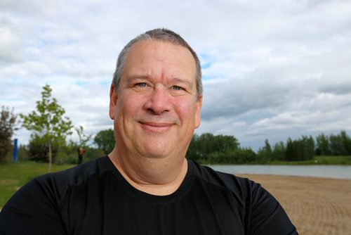 JUSTIN SAMANSKI-LANGILLE / WINNIPEG FREE PRESS
Triathlon coach Gary Pallett poses during a training session with his young athletes on the East Beach inside Birds Hill Provincial Park Thursday.
170622 - Thursday, June 22, 2017.