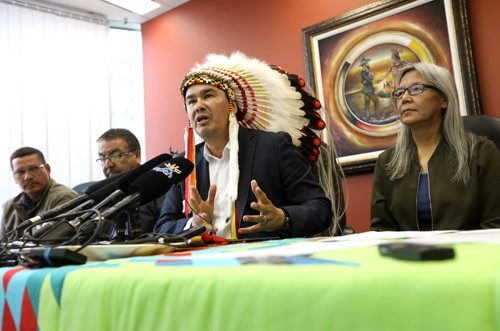 RUTH BONNEVILLE / WINNIPEG FREE PRESS

Keewatin Tribal Council Chiefs hold press conference for governments to take immediate action on repairing the rail line to churchill at MKO office (Manitoba Keewatinowi Okimakanak) in Winnipeg Friday.

Chief Ted Bland of the York Factory First Nation (centre wt feathers) answers questions from the media during press conference.  Names of people at the table L - R:  Robert Spence Councillor with Tataskweyak - Keewatin Tribal First Nation, Clarence Easter Chemawawin Cree nation Chief, Chief Ted Bland of the York Factory First Nation (feathers), Chief Betsy Kennedy War Lake First Nation and Michael Spence Mayor of Churchill (not in this photo but also at the table).  

See story.  
June 23, 2017