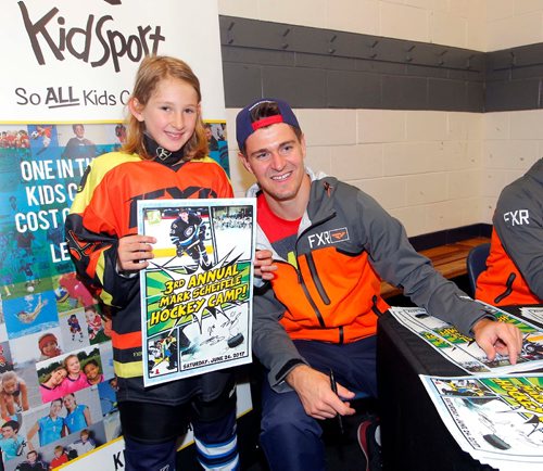 BORIS MINKEVICH / WINNIPEG FREE PRESS
Third Annual Mark Scheifele Hockey Camp in support of KidSport Winnipeg presented by FXR. Mark Scheifele, Winnipeg Jets Center, Team Canada and Team North America player and KidSport Athlete Ambassador, hosted the 3rd Annual Mark Scheifele Hockey Camp in support of KidSport Winnipeg. Here he signs some autographs after an on ice session. From left, Gabby Robbins poses for a photo with Mark Scheifele. June 24, 2017
