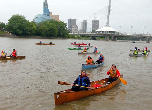 BORIS MINKEVICH / WINNIPEG FREE PRESS
Rendez-Vous on the Red - In celebration of the150th anniversary of Canada, voyageurs of La Brigade de la Rivière Rouge, also celebrating its 40th anniversary, recreated the historic paddle along the Red River from St. Jean-Baptiste to The Forks. Many Canoes on the Rouge on the Red River in front of St. Boniface Cathedral. June 24, 2017
