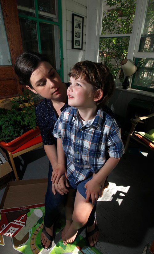 PHIL HOSSACK / WINNIPEG FREE PRESS  -    Rebecca Chambers and her four-year-old son Henry .. (diagnosed with autism last year) pose in their home Monday.
Henry is one of the unknown number of preschool children living with special needs that was going to be denied entry into daycare because of the provinces hold on funding for aides.
But suddenly on Sunday they received calls from the province and the day care to say that suddenly they had funding for an aide.
 June 26, 2017