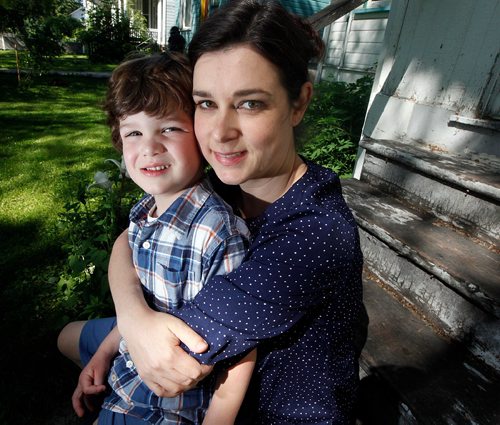 PHIL HOSSACK / WINNIPEG FREE PRESS  -    Rebecca Chambers and her four-year-old son Henry .. (diagnosed with autism last year) pose in their home Monday.
Henry is one of the unknown number of preschool children living with special needs that was going to be denied entry into daycare because of the provinces hold on funding for aides.
But suddenly on Sunday  they received calls from the province and the day care to say that suddenly they had funding for an aide.
 -  June 26, 2017