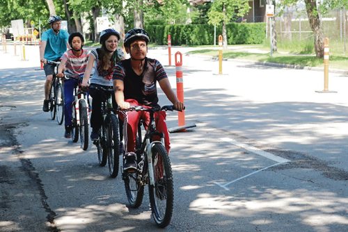 Canstar Community News June 20, 2017 - People try out the pop-up protected bike lanes on Bannatyne Avenue in front of Hugh John MacDonald School. (LIGIA BRAIDOTTI/CANSTAR COMMUNITY NEWS/TIMES)
