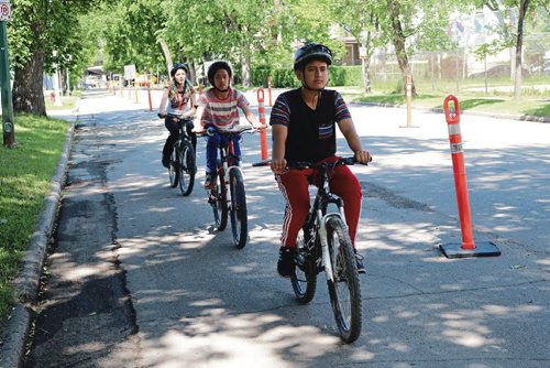 Canstar Community News June 20, 2017 - Kids try out the pop-up bike lanes on Bannatyne Avenue in front of Hugh John MacDonald School. (LIGIA BRAIDOTTI/CANSTAR COMMUNITY NEWS/TIMES)