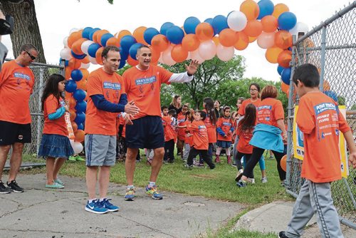 Canstar Community News June 15, 2017 - Winnipeg Police chief Danny Smyth and Kevin Chief greet students as they arrive after the run. (LIGIA BRAIDOTTI/CANSTAR COMMUNITY NEWS/TIMES)