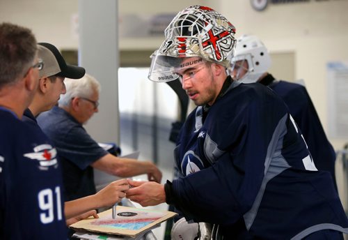 WAYNE GLOWACKI / WINNIPEG FREE PRESS

Goaltender Cole Kehler #30 signs autographs after the on ice session at the annual Winnipeg Jets summer development camp at the Bell MTS Iceplex Tuesday. Mike McIntyre story. June 27   2017