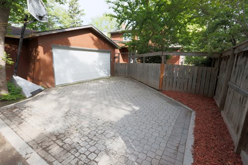 JUSTIN SAMANSKI-LANGILLE / WINNIPEG FREE PRESS
540 Oakenwald includes a large, two car garage with drive that is accessible from the back laneway. The garage can be entered on foot through the backyard.
170627 - Tuesday, June 27, 2017.