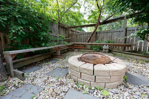 JUSTIN SAMANSKI-LANGILLE / WINNIPEG FREE PRESS
The backyard at 540 Oakenwald is almost entirely deck and features a sheltered sitting area with fire pit and access to the garage.
170627 - Tuesday, June 27, 2017.