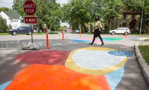 MIKE DEAL / WINNIPEG FREE PRESS
Pedestrians cross the road at Aulneau Street and de la Cathédrale Avenue where a local art project called Cool Streets has been installed. The project had local artists paint designs at various intersections and crosswalks at eight sites.
170627 - Tuesday, June 27, 2017.