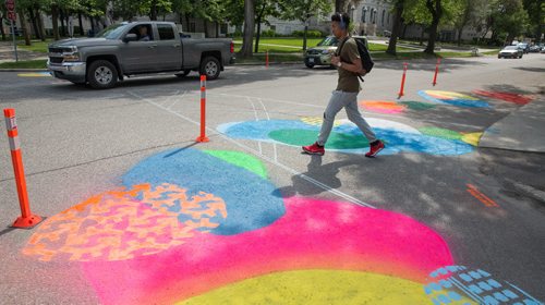 MIKE DEAL / WINNIPEG FREE PRESS
Pedestrians cross the road at Aulneau Street and de la Cathédrale Avenue where a local art project called Cool Streets has been installed. The project had local artists paint designs at various intersections and crosswalks at eight sites.
170627 - Tuesday, June 27, 2017.