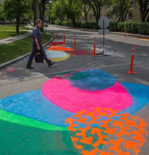 MIKE DEAL / WINNIPEG FREE PRESS
Pedestrians cross the road at Aulneau Street and de la Cathédrale Avenue where a local art project called Cool Streets has been installed. The project had local artists paint designs at various intersections and crosswalks at eight sites.
170627 - Tuesday, June 27, 2017.