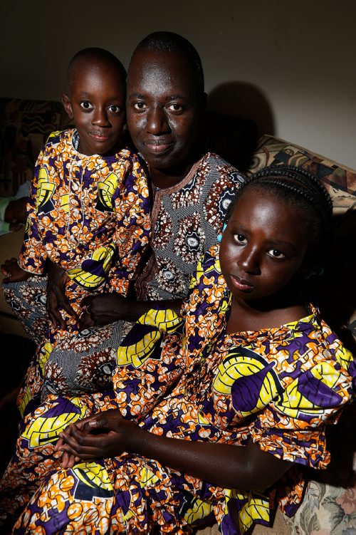 JOHN WOODS / WINNIPEG FREE PRESS
Abdoul Toure is photographed with two of his children Papé and Adjara in their St Vital home in Winnipeg Tuesday, June 27, 2017. Abdoul is a French-speaking man from Mali with a masters degree in economics and is cleaning schools while he tries to improve his English so he can go back to university to get his degree recognized here. Hes upset that the feds are cutting funding for English classes beyond basic survival ESL.