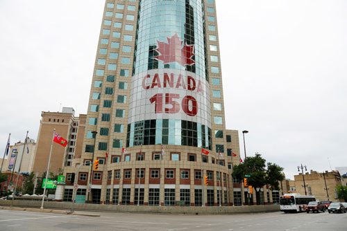 JUSTIN SAMANSKI-LANGILLE / WINNIPEG FREE PRESS
Harvard Developments unveiled a new 14 story tall mural celebrating Canada's 150th Wednesday. The mural is on the face of 201 Portage and is 5,000 squared feet in surface area.
170628 - Wednesday, June 28, 2017.
