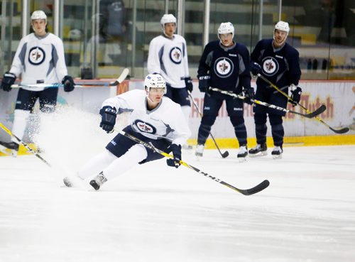 JUSTIN SAMANSKI-LANGILLE / WINNIPEG FREE PRESS
Dylan Samberg makes a sharp turn during a drill at Jets development camp Wednesday.
170628 - Wednesday, June 28, 2017.