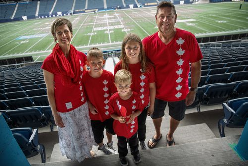 MIKE DEAL / WINNIPEG FREE PRESS
Annelize Loewen and her husband Gary with kids (from left); Kian, 8, Zandry, 5, and Karalize, 10, were among the 93 new citizens at a special citizenship ceremony in celebration of Canada's 150th birthday, at the Investors Group Field.
170628 - Wednesday, June 28, 2017.
