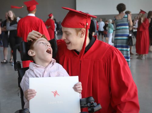 RUTH BONNEVILLE / WINNIPEG FREE PRESS

49.8 Feature: Class of  2017 Project:    
Griffin shares a touching moment with his younger brother, Tyler who has cerebral palsy, after receiving his diploma at his convocation ceremony.  
Final photos of The class of 2017 students (15),  on their graduation day from Glenlawn Collegiate.  Their convocation ceremony was held at The RBC Convention Centre on June 26th 2017 as well as their dinner and dance later that evening.  
See story on WFP's 13 year documentary on a group of students  who the Free Press followed and photographed from their 1st year in kindergarden in Windsor School to their graduating year in 2017 at Glenlawn Collegiate. 

See Doug Speirs story.  

June 26, 2017